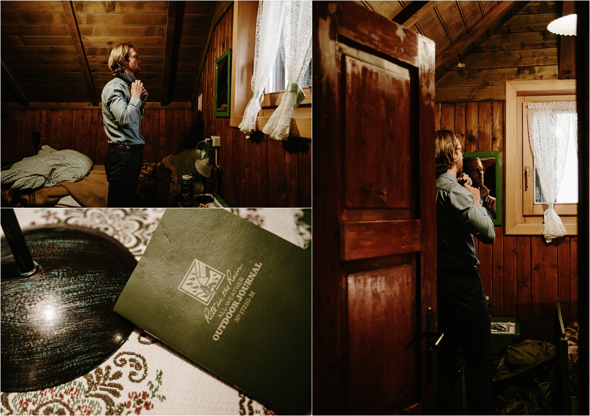 The groom Adam getting ready in the mountain hut for his hiking elopement. Photography by Wild Connections Photography