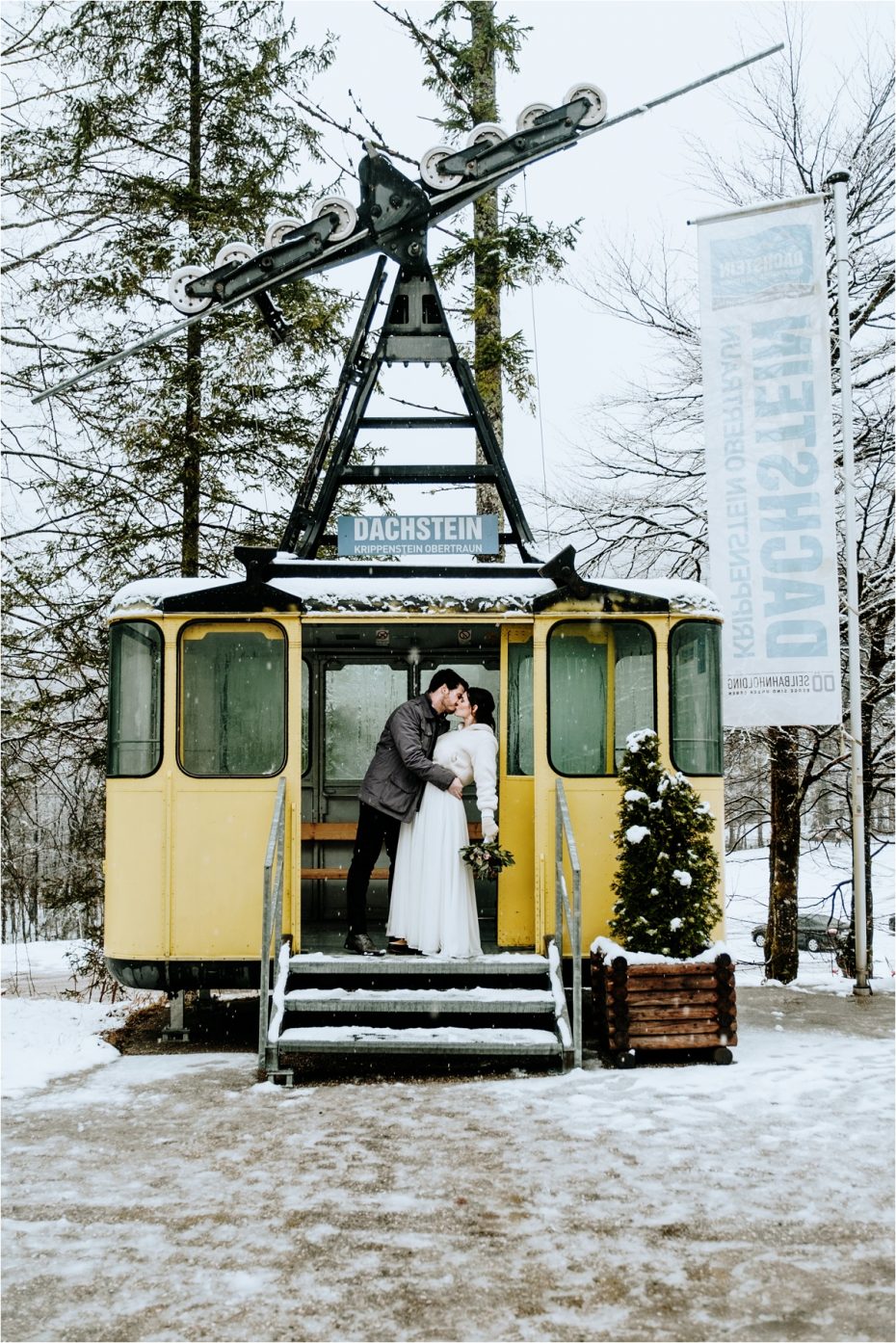 Bride and groom kiss in a vintage cable car in Hallstatt Austria after their elopement wedding. Photos by Wild Connections Photography