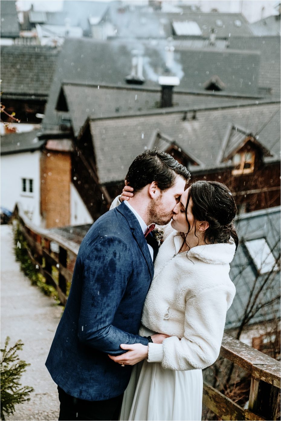 Bride and groom recreate a scene from the notebook, kissing in the rain. Photos by Wild Connections Photography