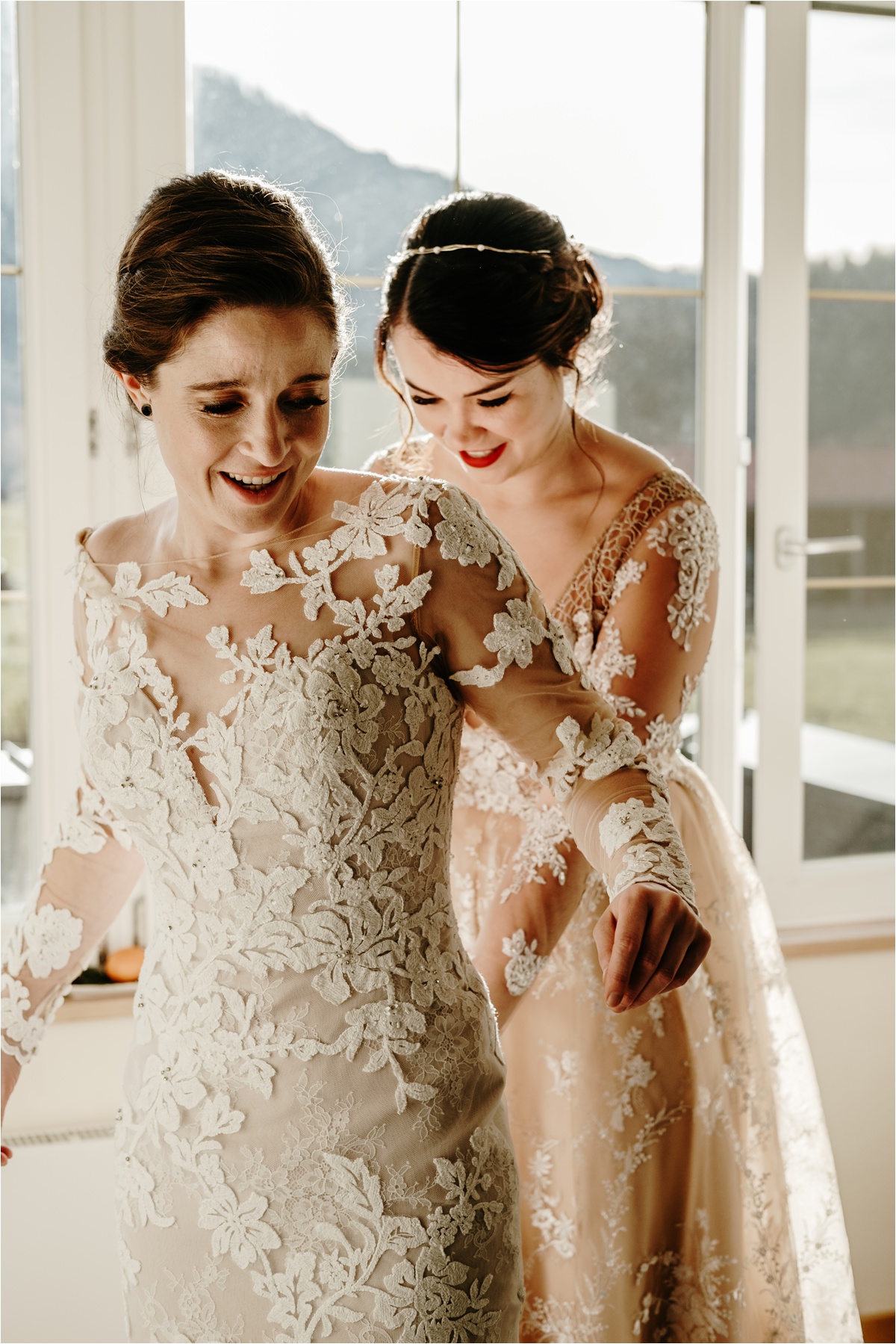 Two brides get ready for their wedding together. Photo by Wild Connections Photography