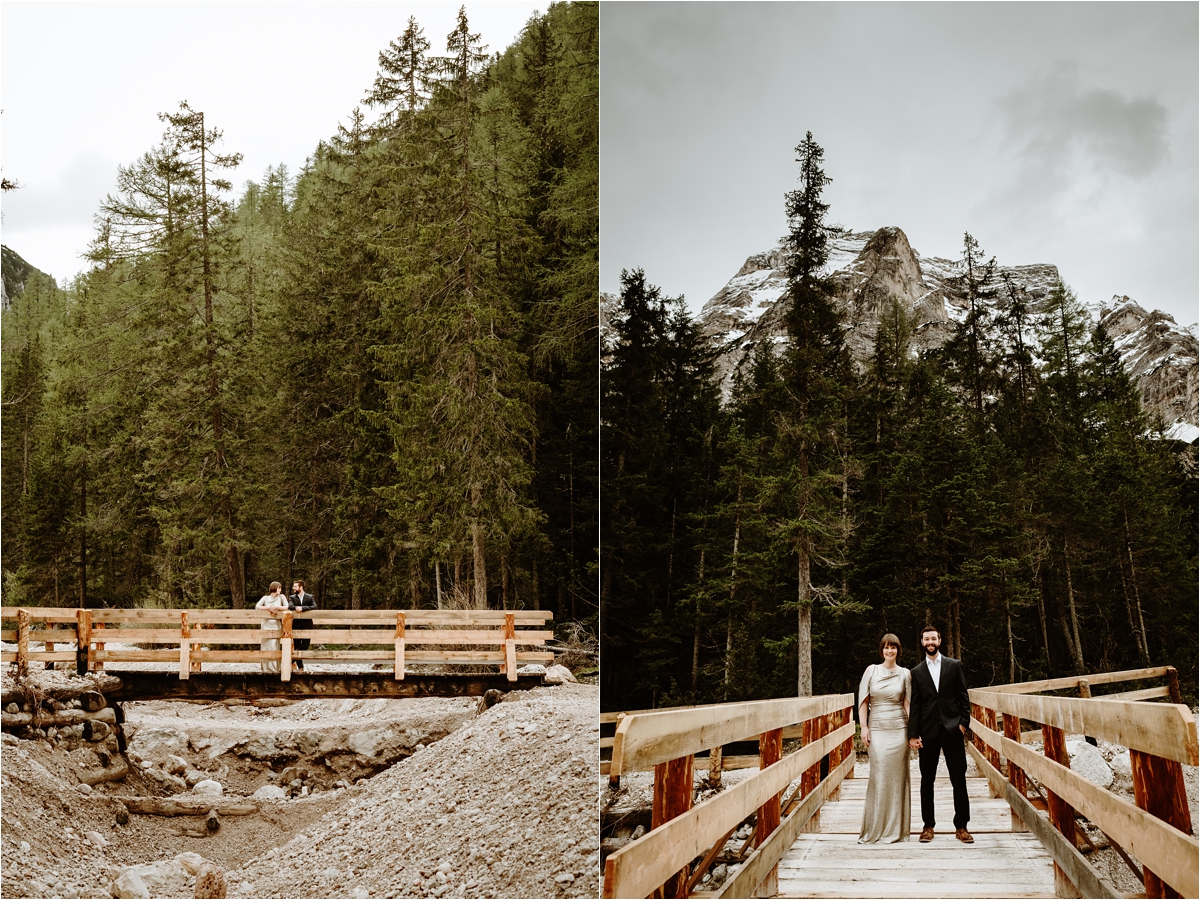 Laurel & Dustin stand on a wooden bridge over a stream in to Lake Braies in the Italian Alps. Photo by Wild Connections Photography