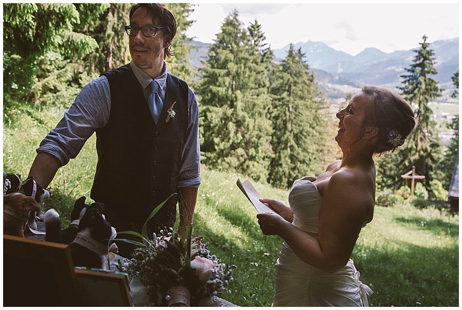 St Johann in Tirol Elopement Nikki laughs as she reads her vows to Chris by Wild Connections Photography