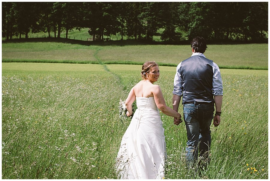 St Johann in Tirol Elopement Nikki & Chris go for a walk in a field by Wild Connections Photography
