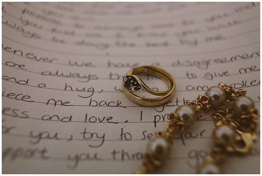 St Johann in Tirol Elopement Nikki's jewellery lies on top of her hand written vows by Wild Connections Photography
