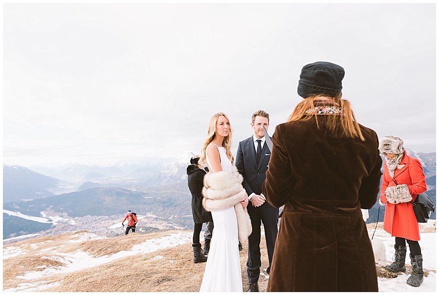 A hiker appears in the background of Steph and Lee's ceremony