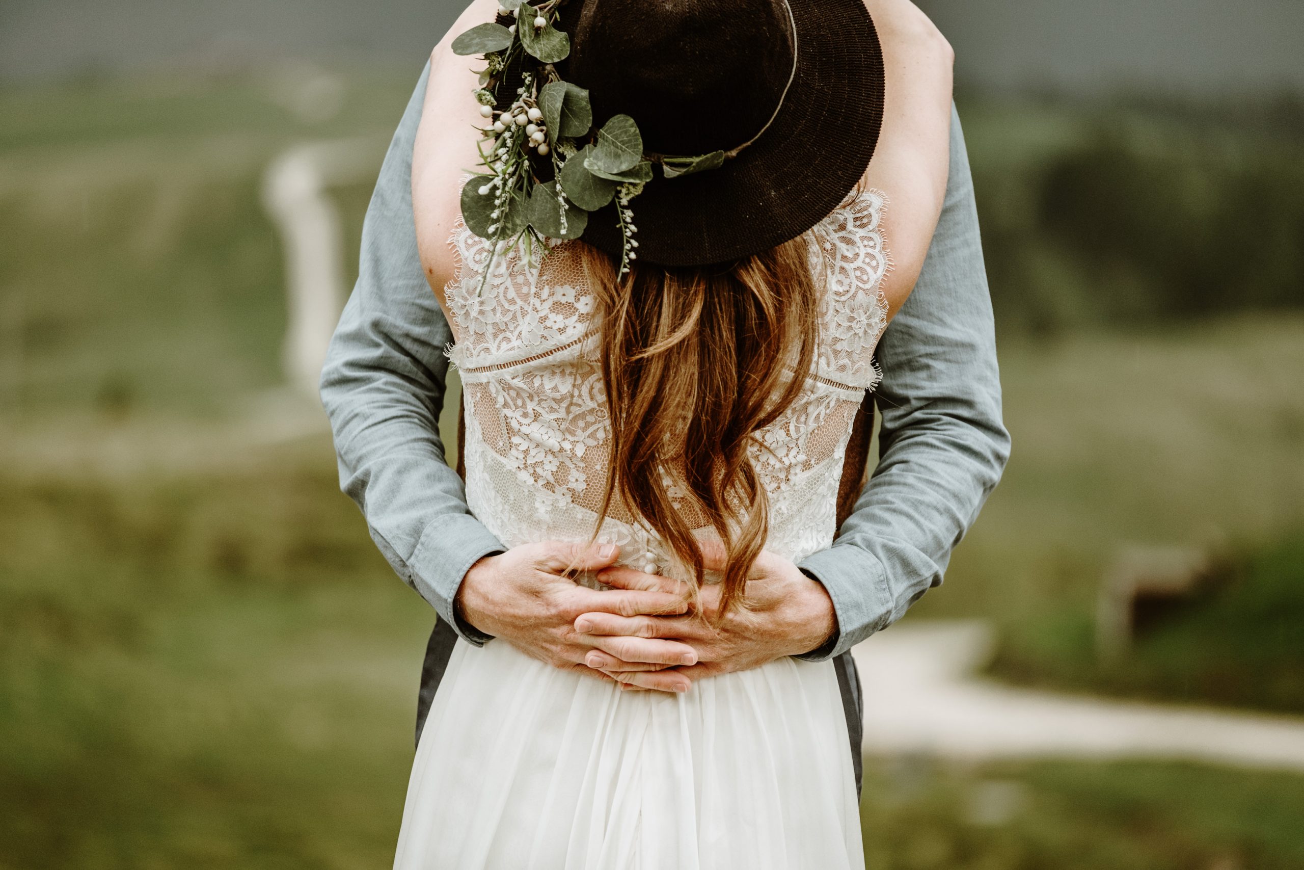 Bride in a hat for her Dolomites elopement by Wild Connections Photography