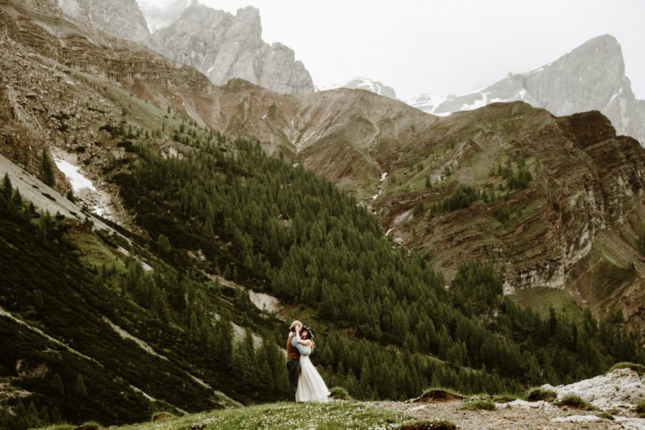 Bride and groom on a mountain top in the Italian Dolomite mountains