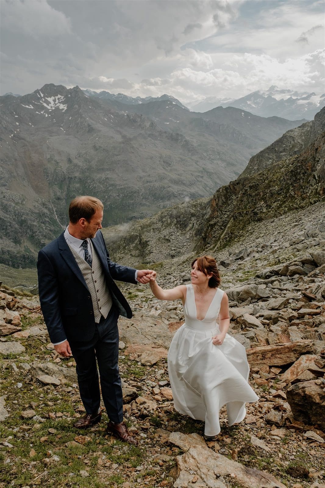 bride and groom hiking in the mountains of Tirol Austria