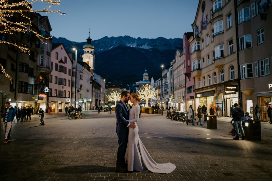 Bride and groom visit the Christmas markets in Innsbruck for their winter elopement