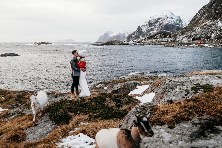 Bride and groom kiss in the Norwegian fjords