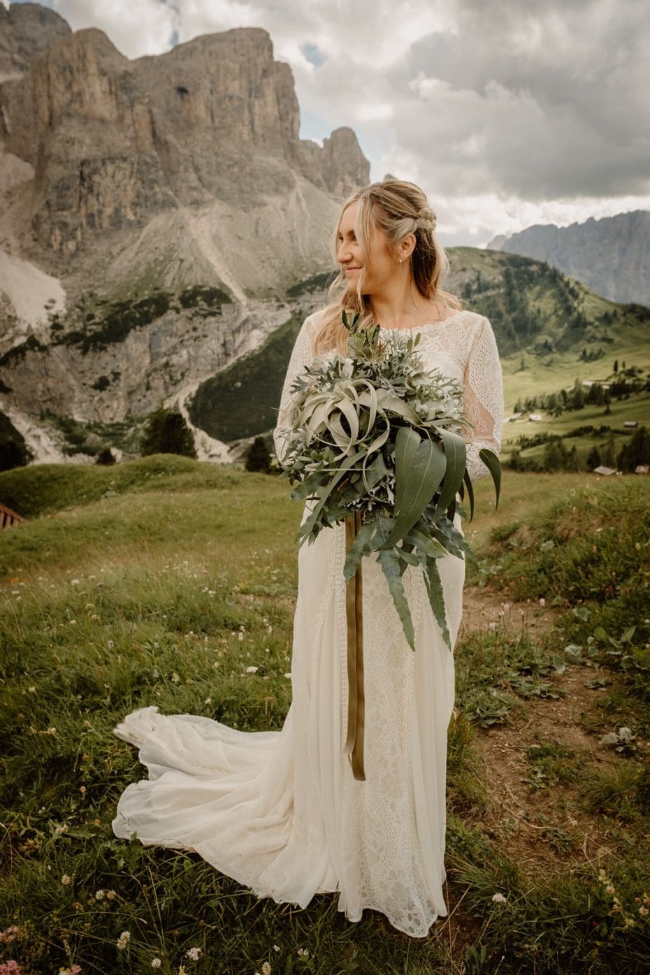 Bride hold bouquet of just green leaves such as ferns, eucalyptus and air plants